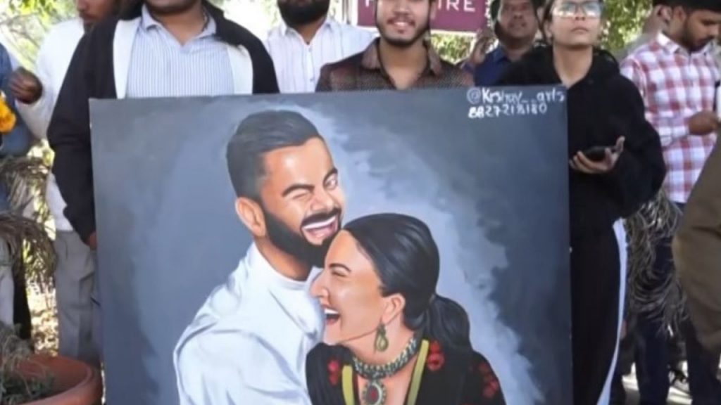 A cricket fan brought a picture of Virat Kohli and Anushka.