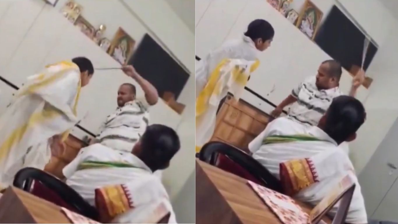 A teacher beating a student