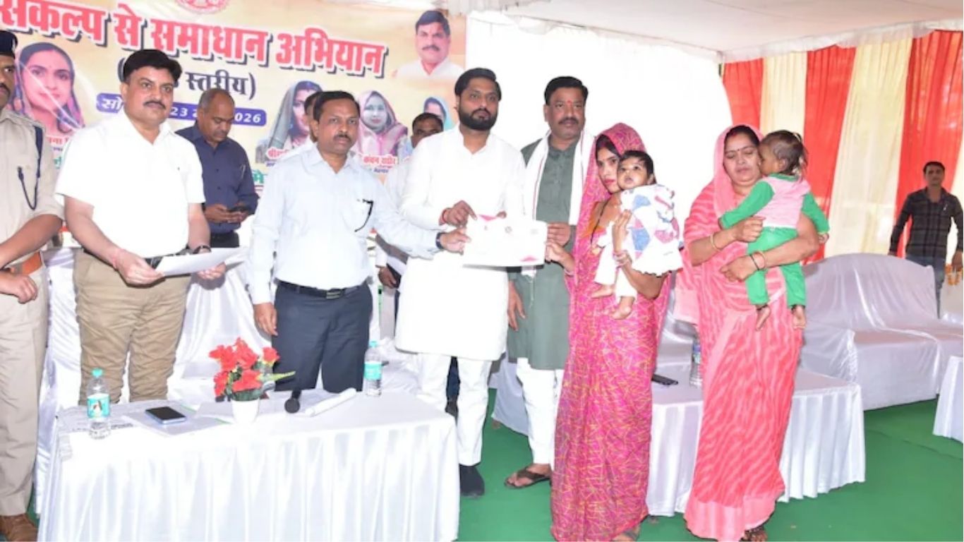 The Minister's son presenting certificates at the event.