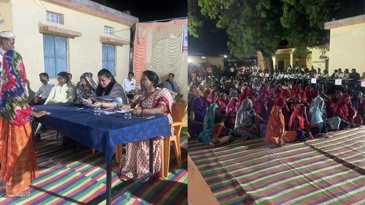 In Alirajpur, the Collector sat on a cot at night and listened to the problems of the villagers.