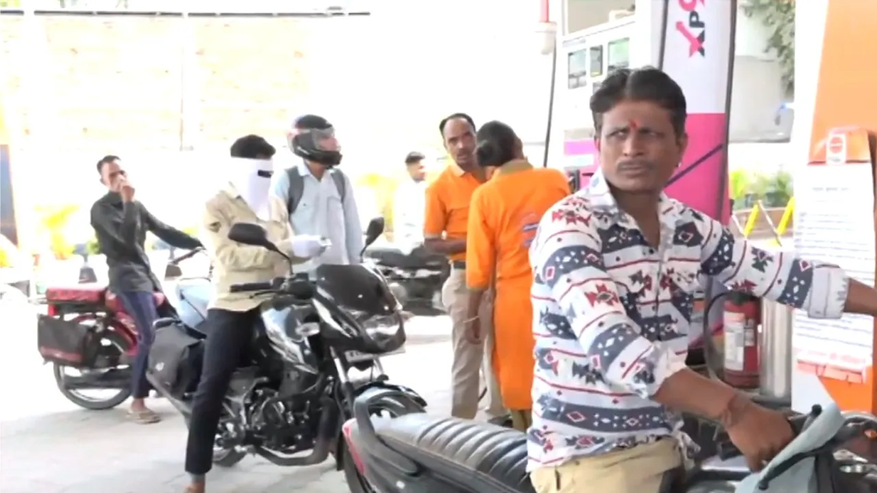 People filling petrol in Ujjain after the increase in petrol and diesel prices.